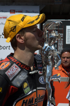 Ian Hutchinson celebrates his maiden TT win during the Centenary of the event